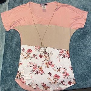 it’s pick with a brown tan color with white and with flowers, it’s really soft